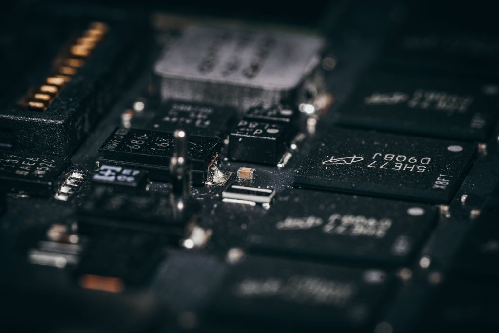 Detailed macro shot of electronic circuit components showcasing intricate design and layout.
